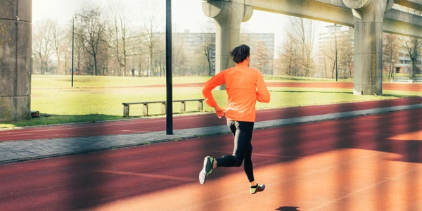Runner in orange jacket